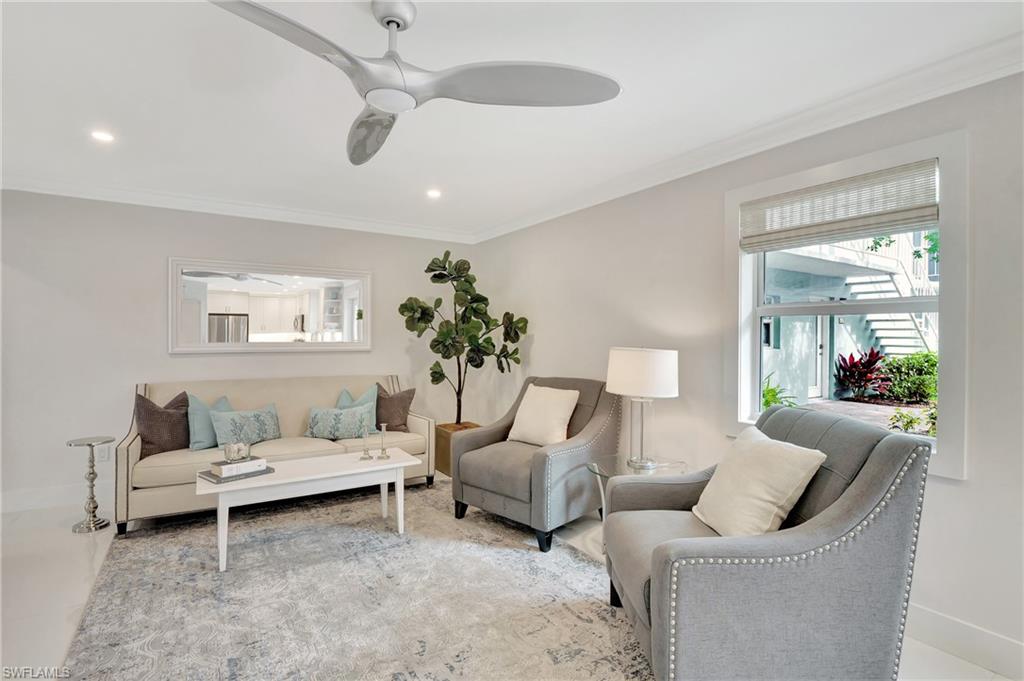 603 12th Avenue South Naples, FL 34102 - Photo 7 of 47 a living room with furniture and a potted plant