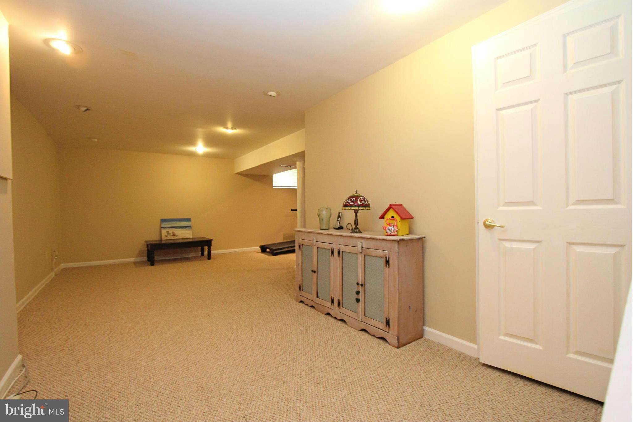 9338 Ramblebrook Road Baltimore, MD 21236 - Photo 19 of 25 a view of a livingroom with game equipment