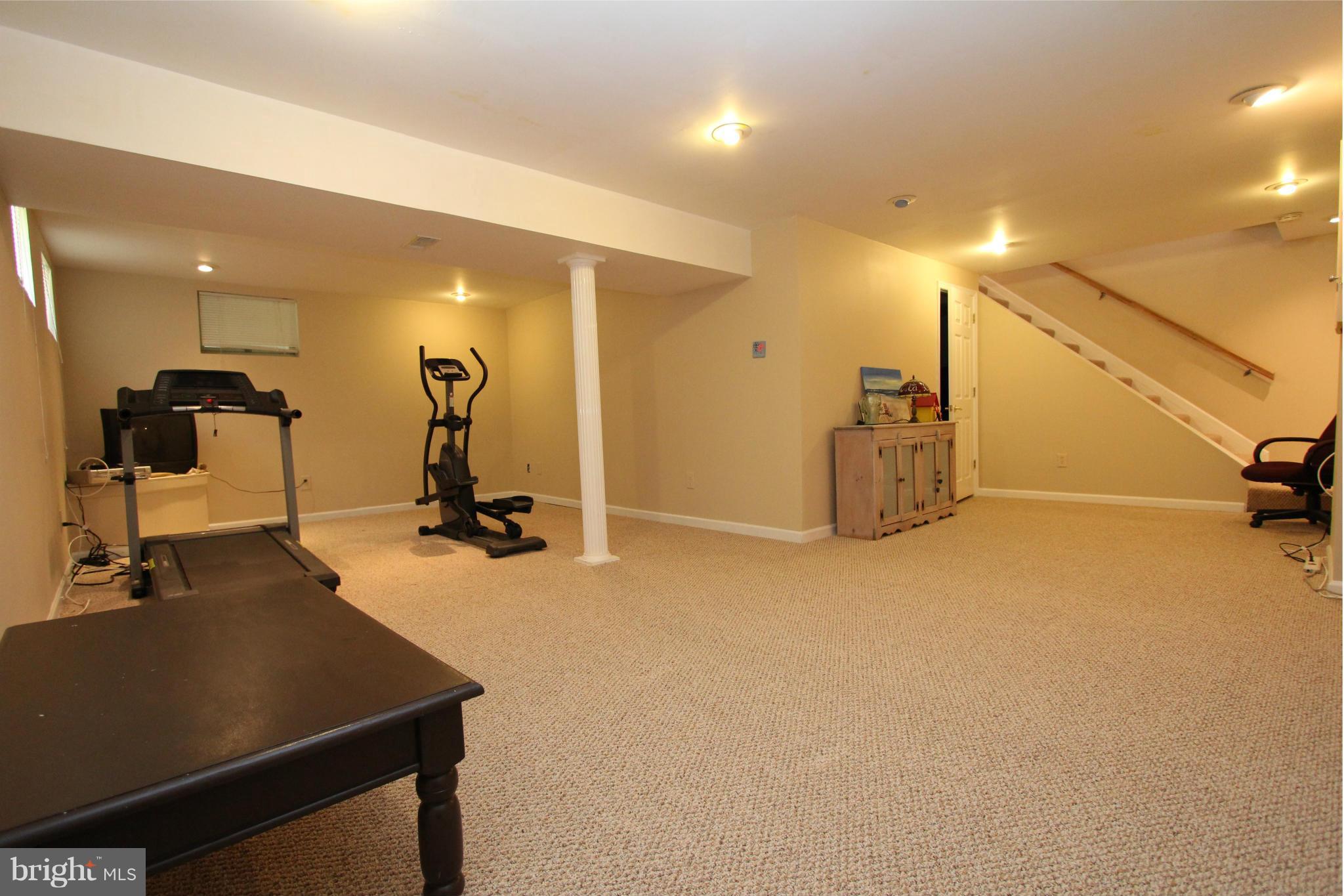 9338 Ramblebrook Road Baltimore, MD 21236 - Photo 20 of 25 a view of a room with gym equipment