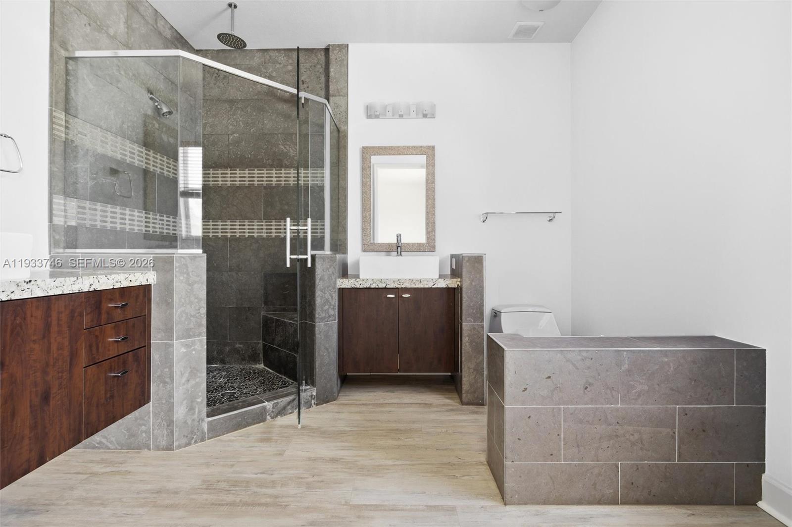 4857 Northwest 16th Terrace Boca Raton, FL 33431 - Photo 12 of 45 a bathroom with a sink and a mirror