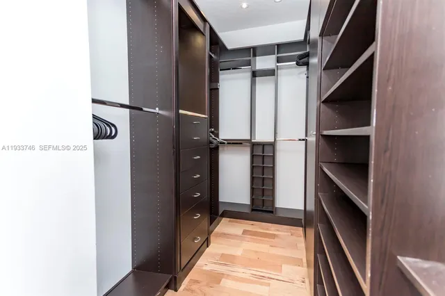 a bathroom with a granite countertop bathtub sink vanity and mirror