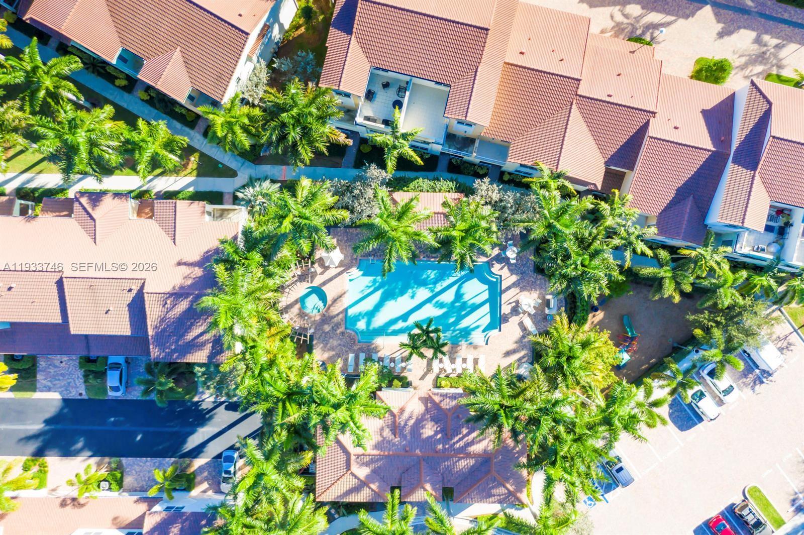 4857 Northwest 16th Terrace Boca Raton, FL 33431 - Photo 23 of 45 an aerial view of a house with a yard and garden