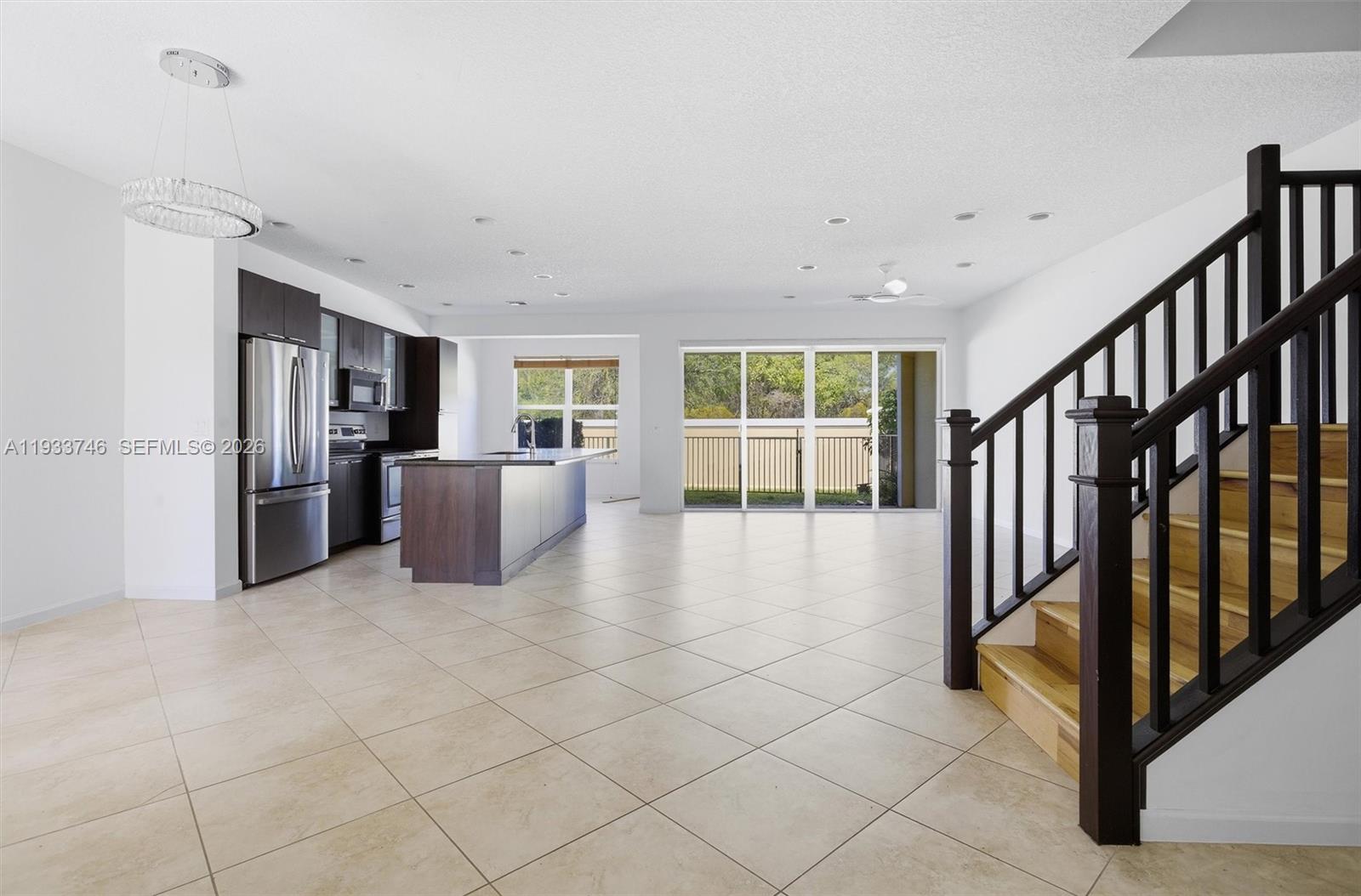 4857 Northwest 16th Terrace Boca Raton, FL 33431 - Photo 3 of 45 a view of kitchen with furniture and refrigerator