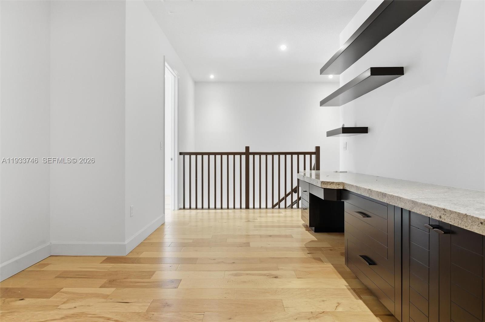 4857 Northwest 16th Terrace Boca Raton, FL 33431 - Photo 32 of 45 a view of a hallway with wooden floor and staircase