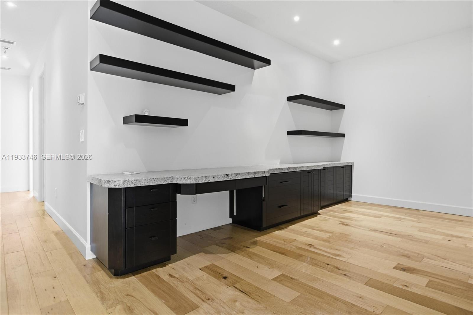 4857 Northwest 16th Terrace Boca Raton, FL 33431 - Photo 34 of 45 a kitchen with stainless steel appliances granite countertop a sink and a stove