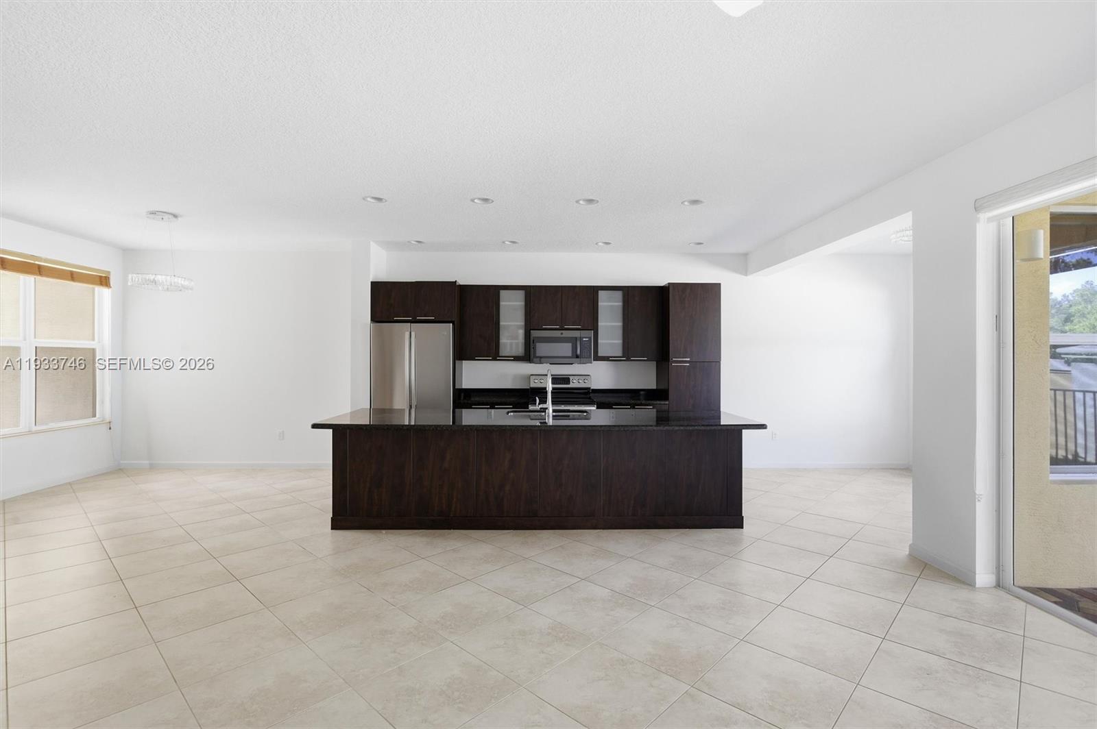 4857 Northwest 16th Terrace Boca Raton, FL 33431 - Photo 42 of 45 a living room with furniture and a flat screen tv