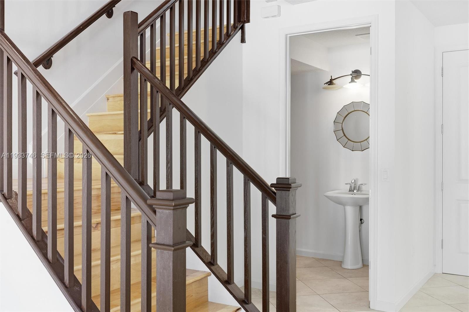 4857 Northwest 16th Terrace Boca Raton, FL 33431 - Photo 6 of 45 a view of staircase with railing and white walls