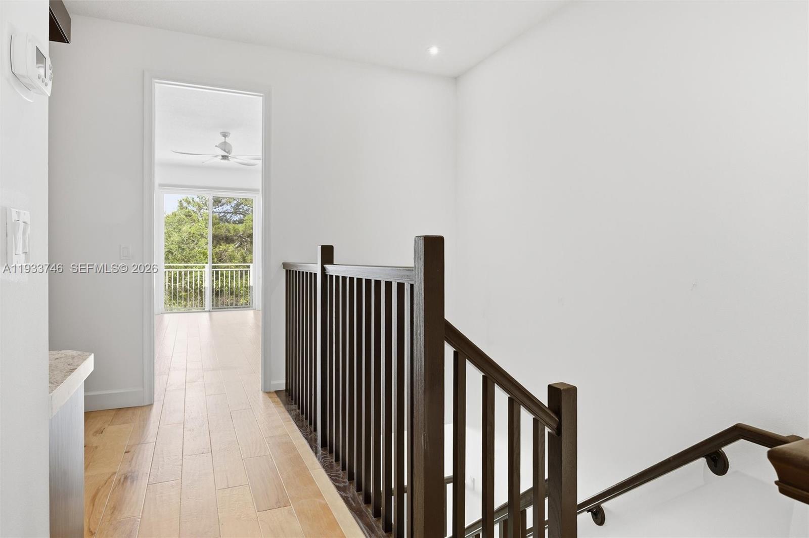 4857 Northwest 16th Terrace Boca Raton, FL 33431 - Photo 7 of 45 a view of a hallway with wooden floor and stairs