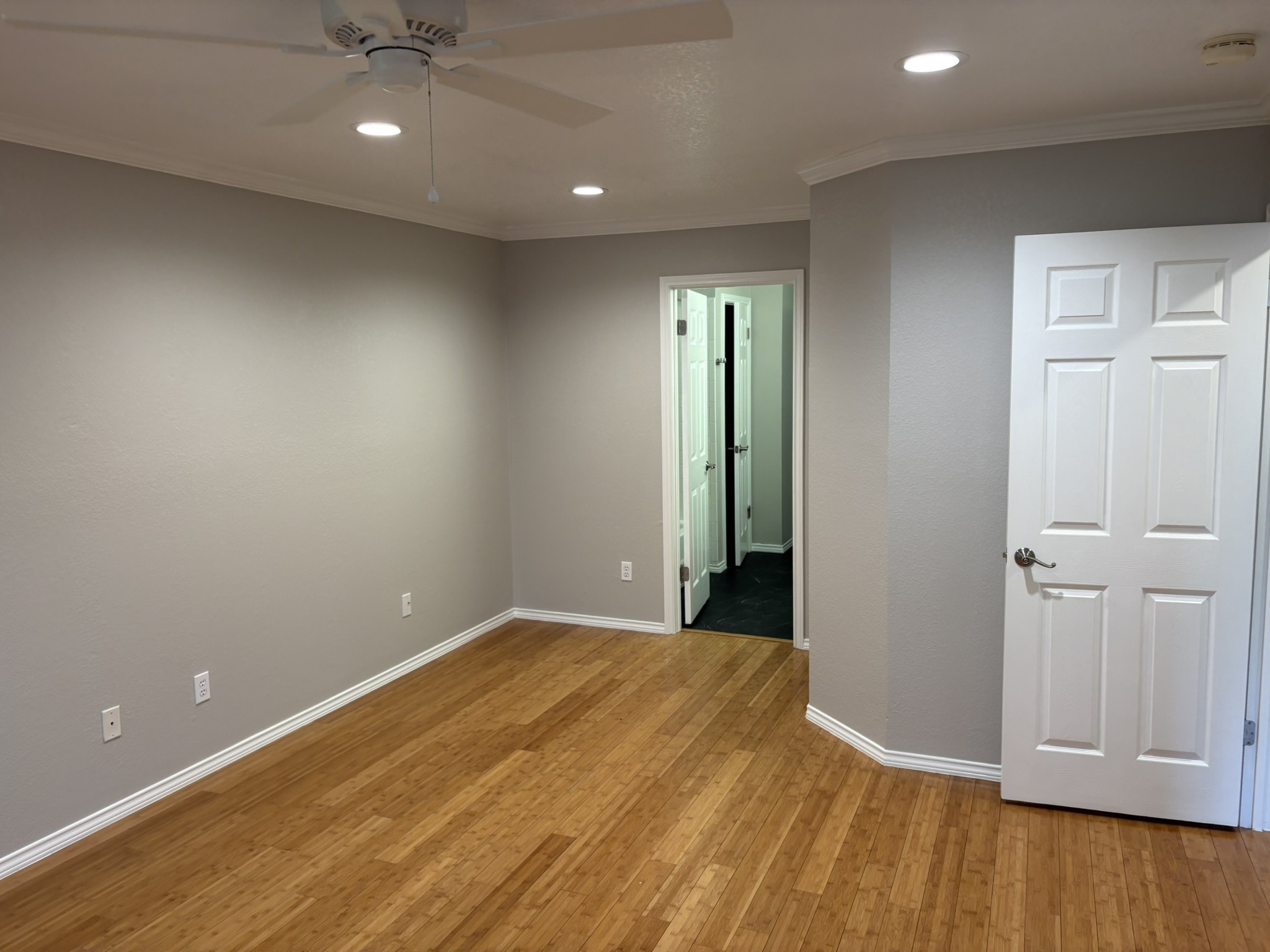 14707 Single Trace Austin, TX 78728 - Photo 16 of 17 A spacious room features beautiful wood flooring and bright recessed lighting, perfect for any living arrangement.