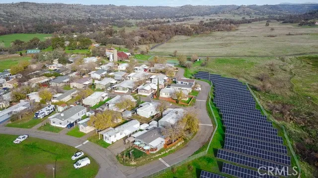 a kitchen with stainless steel appliances granite countertop a refrigerator stove and sink