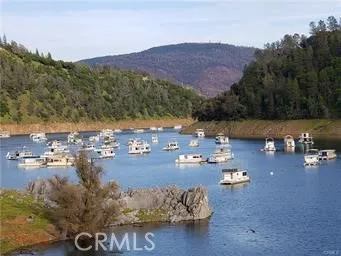 a bathroom with a granite countertop sink mirror and shower