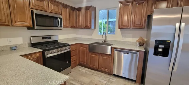a kitchen with a sink and refrigerator