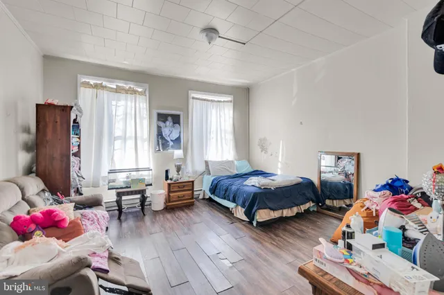 a bed room with a bed and a tv