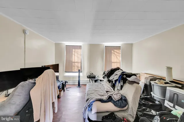 a room with furniture and a flat screen tv