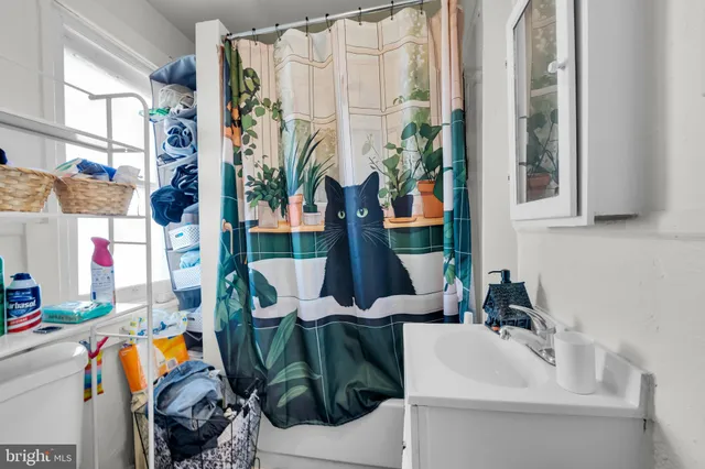 a kitchen with a refrigerator and a sink