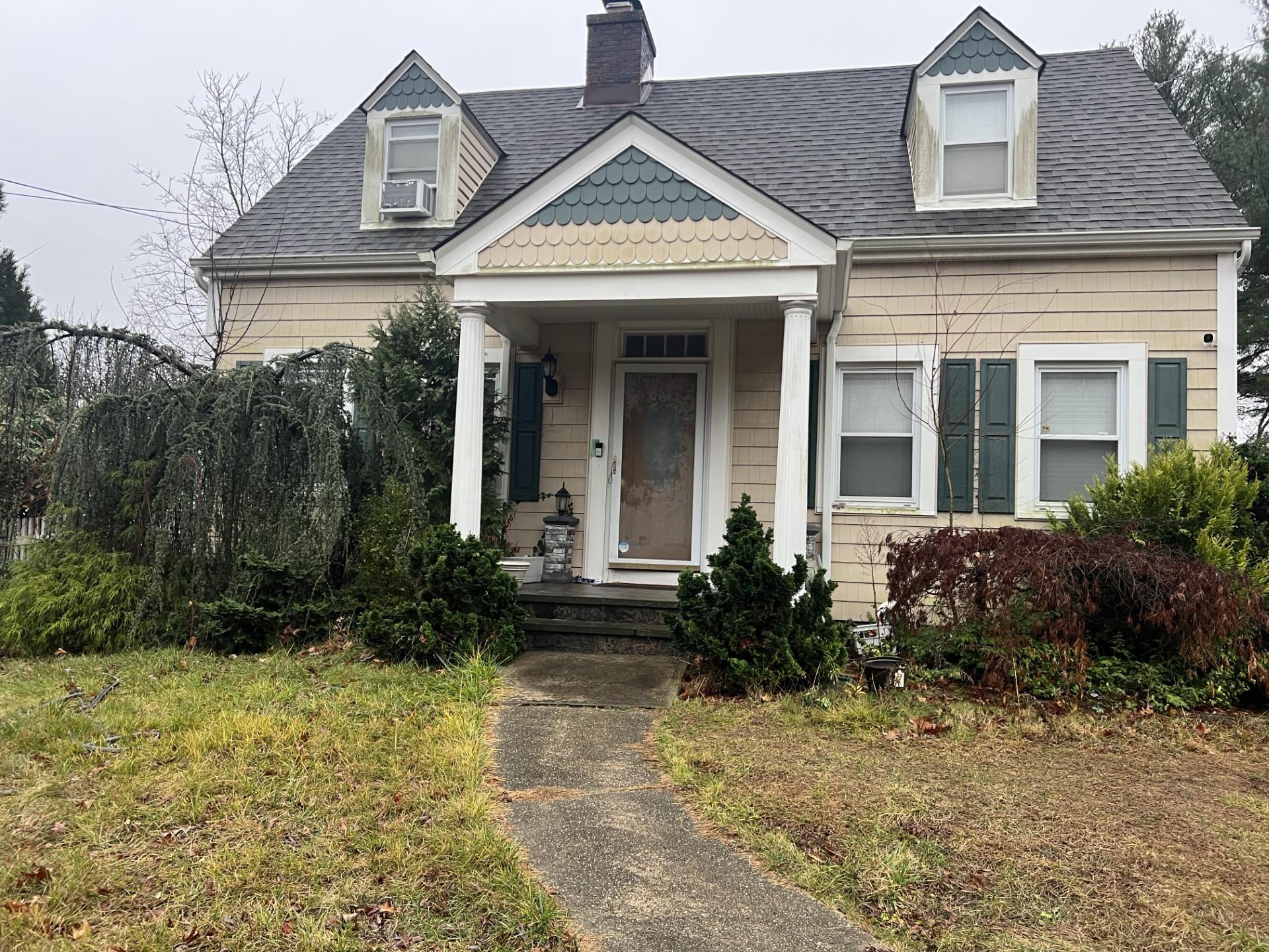 1450 Merritts Road Farmingdale, NY 11735 - Photo 1 of 1 View of front of property with cooling unit