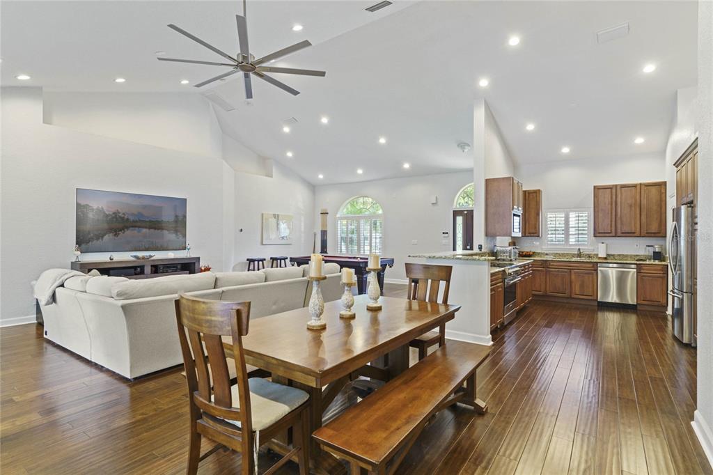 715 Magnolia Street Windermere, FL 34786 - Photo 12 of 44 a large kitchen with a table and chairs in it