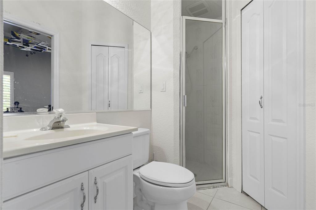 715 Magnolia Street Windermere, FL 34786 - Photo 20 of 44 a bathroom with a toilet a sink and mirror