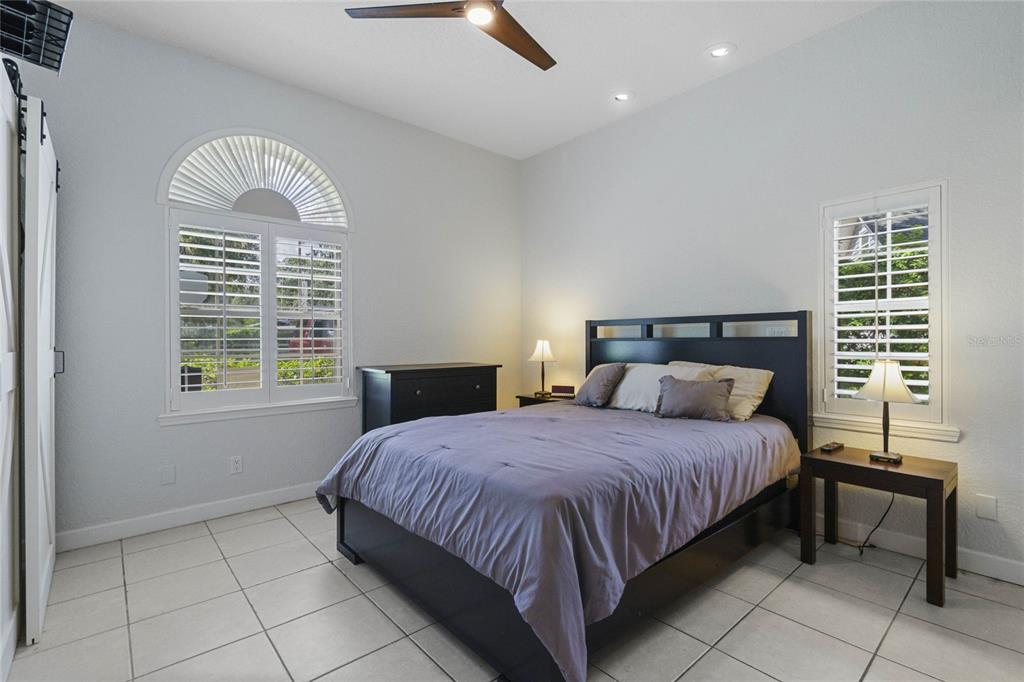 715 Magnolia Street Windermere, FL 34786 - Photo 21 of 44 a bedroom with a bed and a table