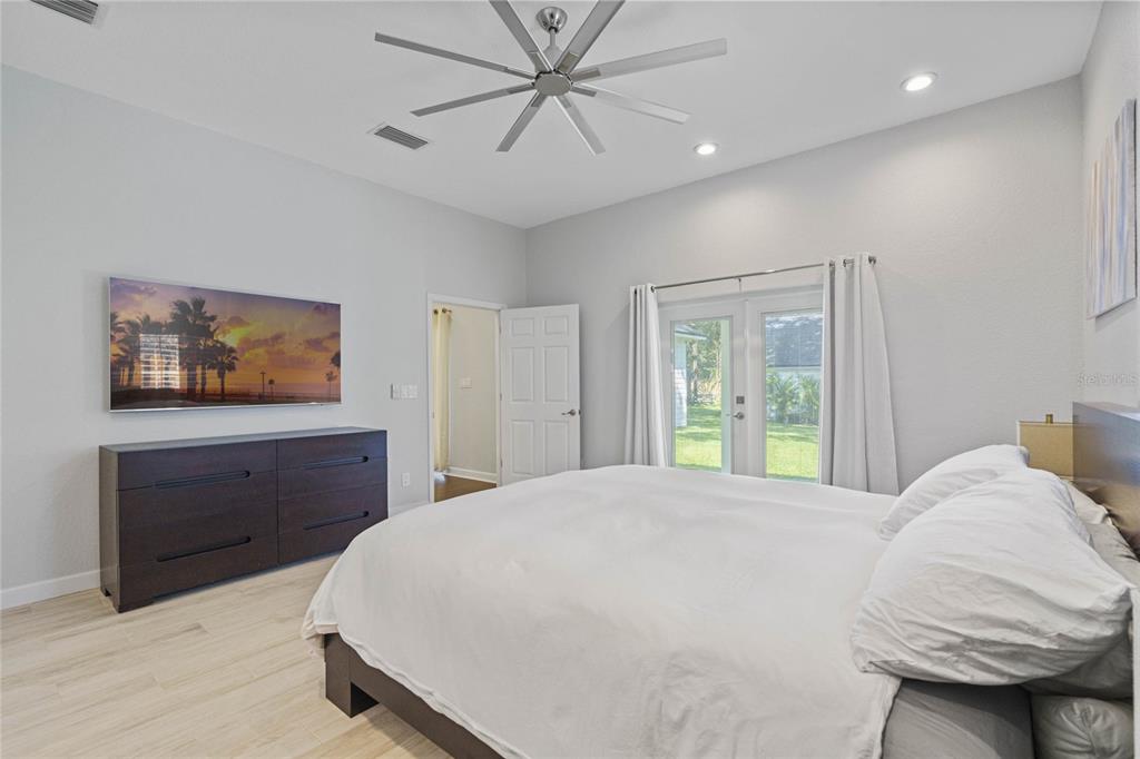 715 Magnolia Street Windermere, FL 34786 - Photo 25 of 44 a bedroom with a bed and a dresser