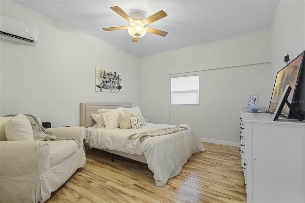 715 Magnolia Street Windermere, FL 34786 - Photo 30 of 44 a bedroom with a bed and a chandelier