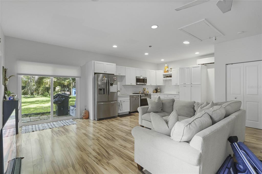 715 Magnolia Street Windermere, FL 34786 - Photo 32 of 44 a living room with furniture and a large window