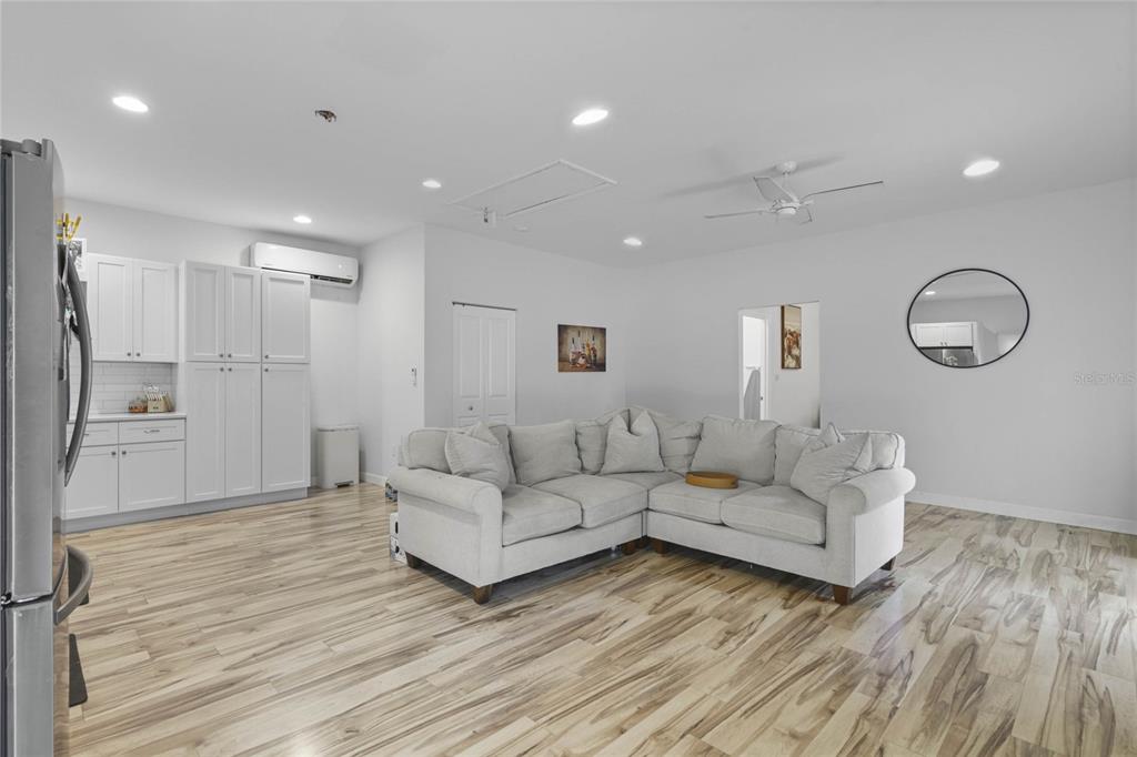 715 Magnolia Street Windermere, FL 34786 - Photo 33 of 44 a living room with furniture and a wooden floor