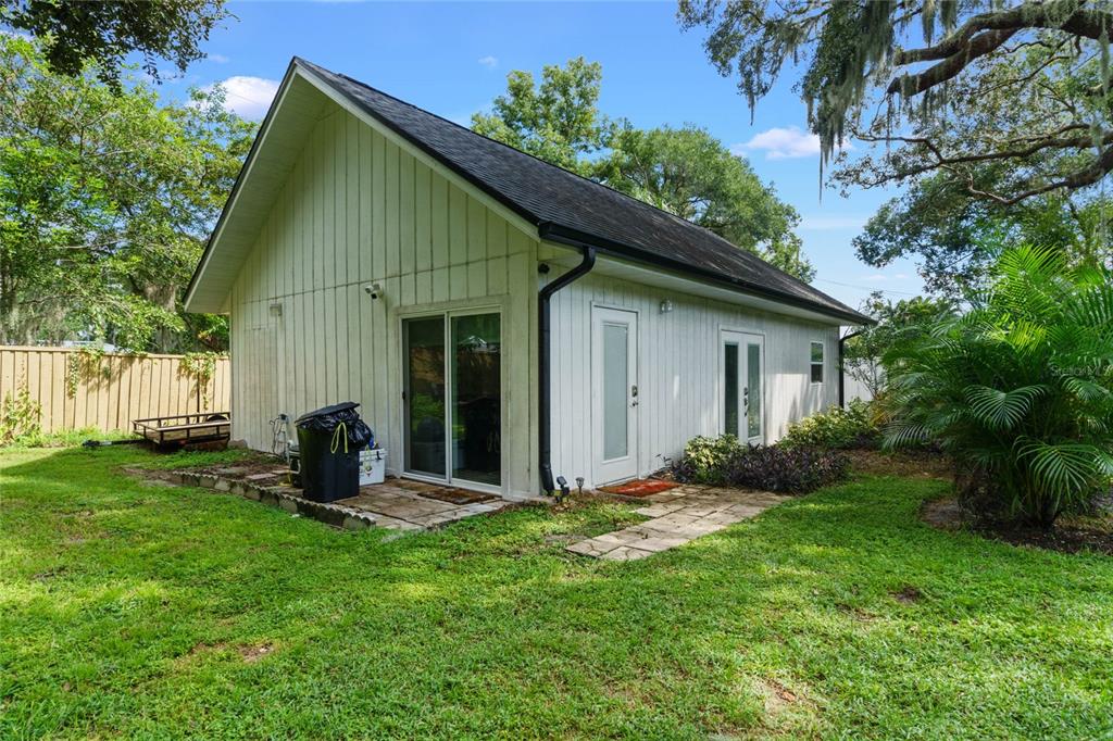 715 Magnolia Street Windermere, FL 34786 - Photo 35 of 44 a view of a house with a yard and garden