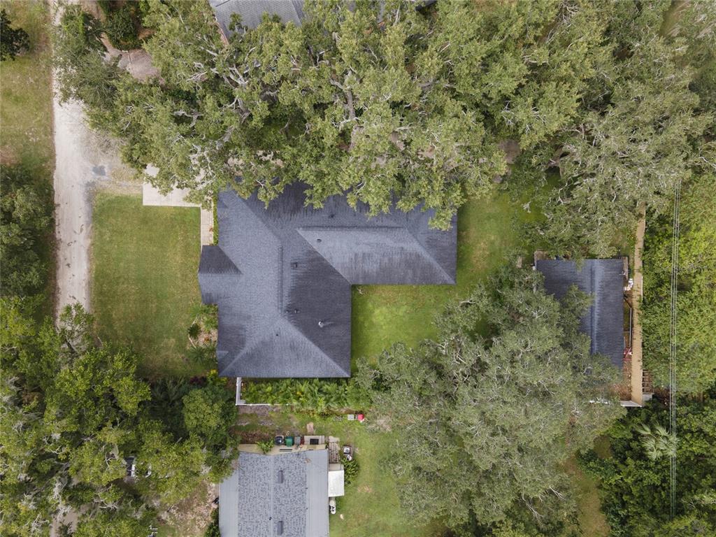 715 Magnolia Street Windermere, FL 34786 - Photo 43 of 44 an aerial view of a house with a yard and a large tree