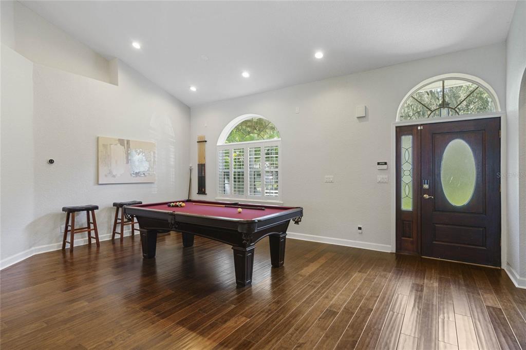 715 Magnolia Street Windermere, FL 34786 - Photo 5 of 44 a room with furniture window and wooden floor