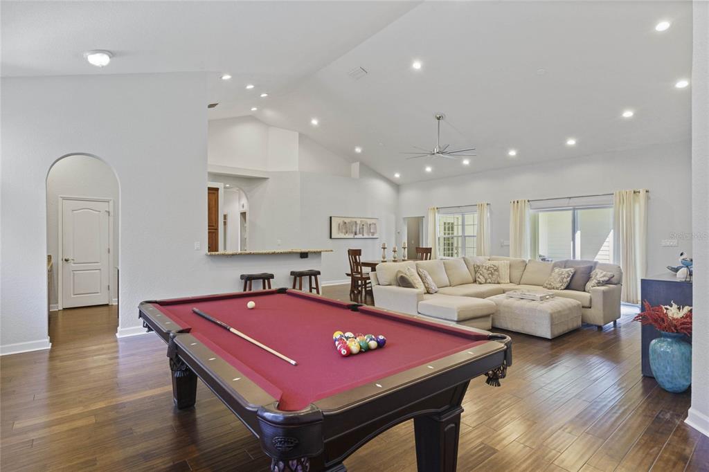 715 Magnolia Street Windermere, FL 34786 - Photo 7 of 44 a living room with furniture a pool table and a couch
