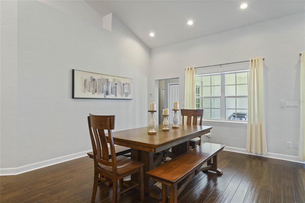 715 Magnolia Street Windermere, FL 34786 - Photo 10 of 44 a view of a dining room with furniture and wooden floor