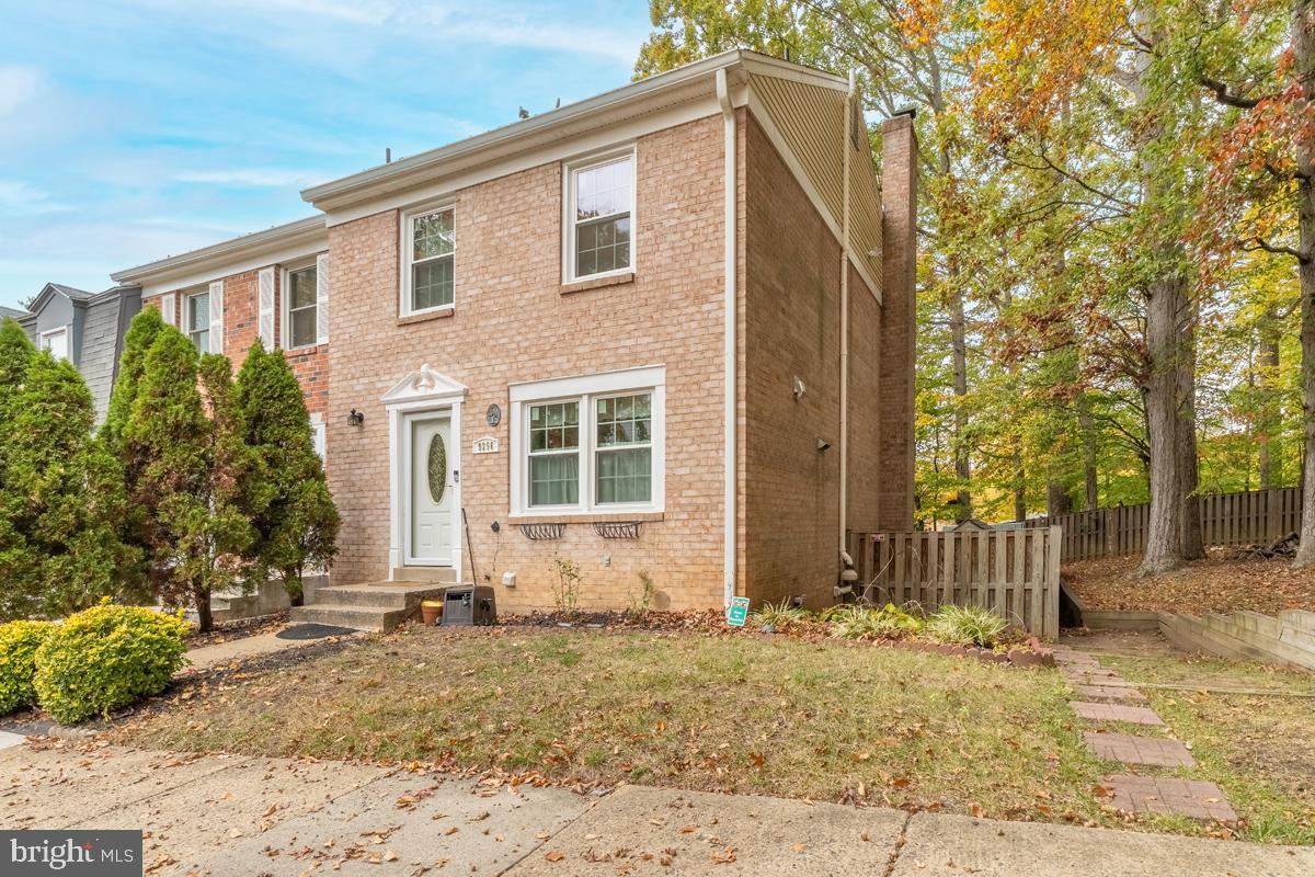 9256 Sprucewood Road Burke, VA 22015 - Photo 1 of 13 a front view of a house with a yard