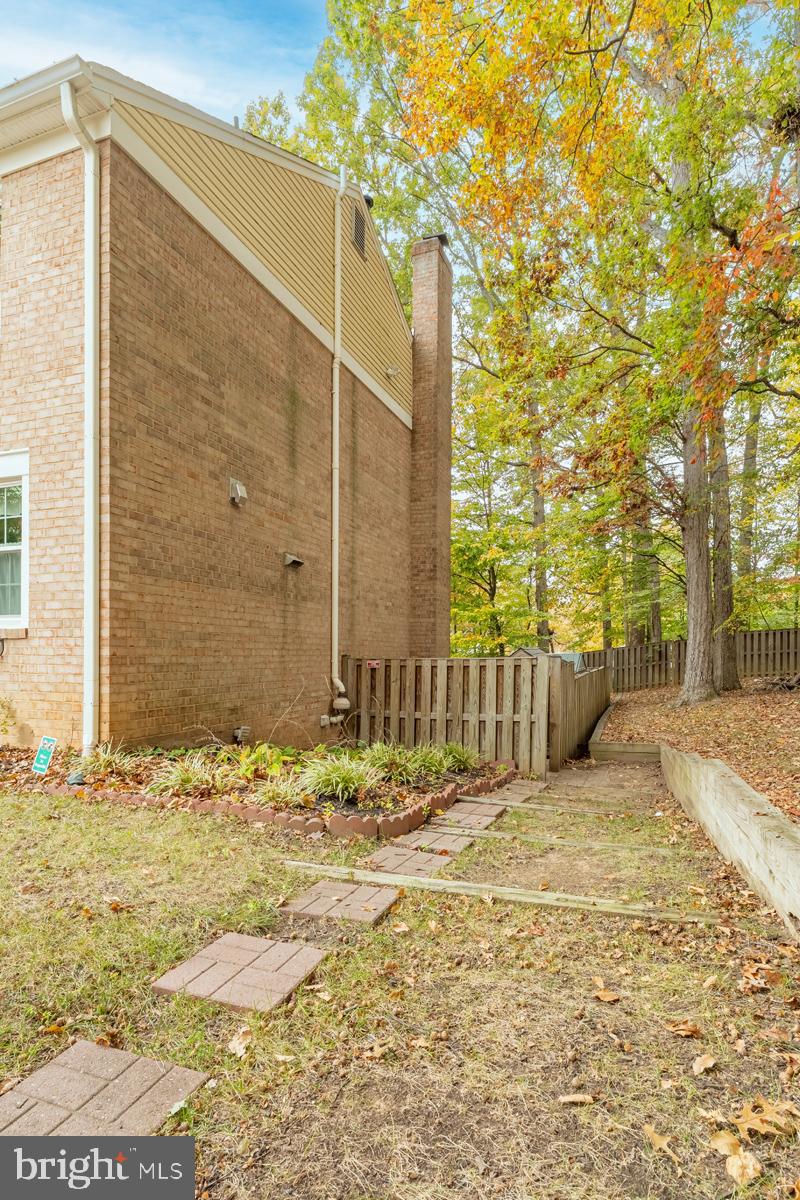 9256 Sprucewood Road Burke, VA 22015 - Photo 2 of 13 a view of a backyard of the house
