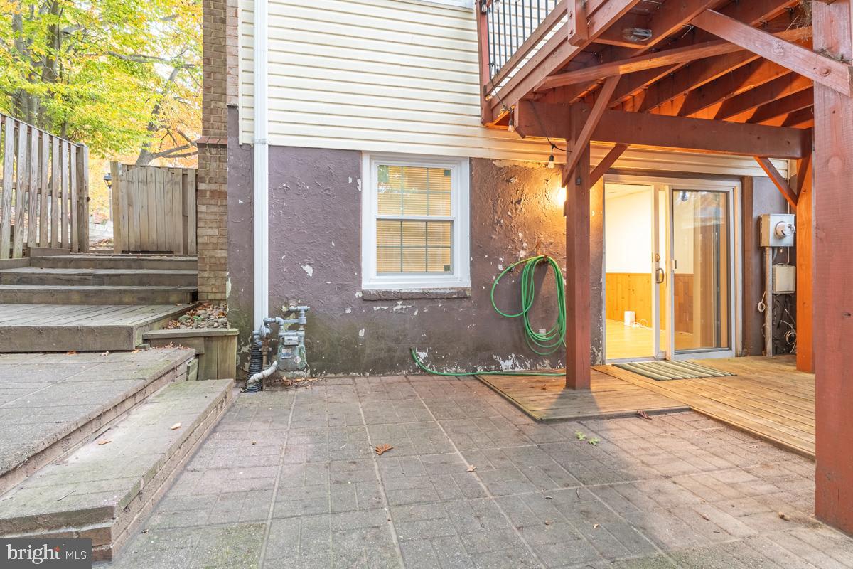 9256 Sprucewood Road Burke, VA 22015 - Photo 4 of 13 a view of a house with a backyard and porch