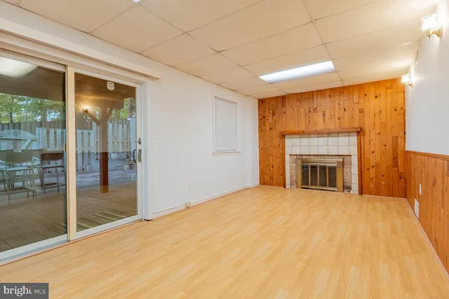 a view of an empty room with glass door