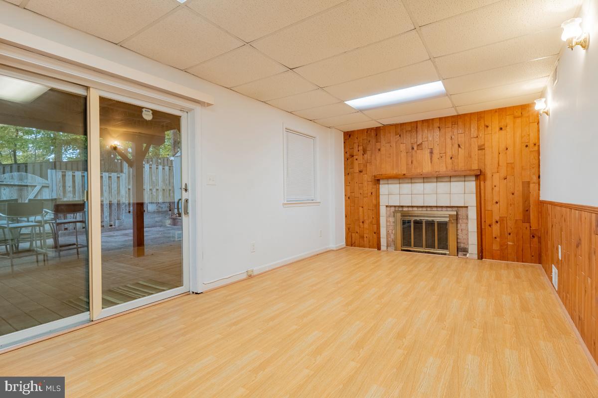 9256 Sprucewood Road Burke, VA 22015 - Photo 8 of 13 a view of an empty room with glass door
