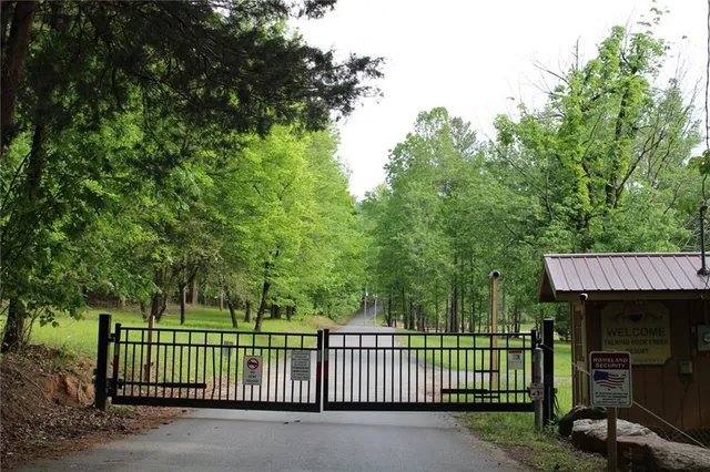 a view of a wooden deck and a forest