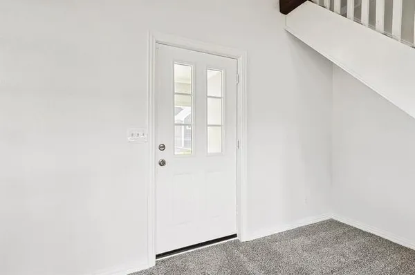 a view of a livingroom with wooden floor