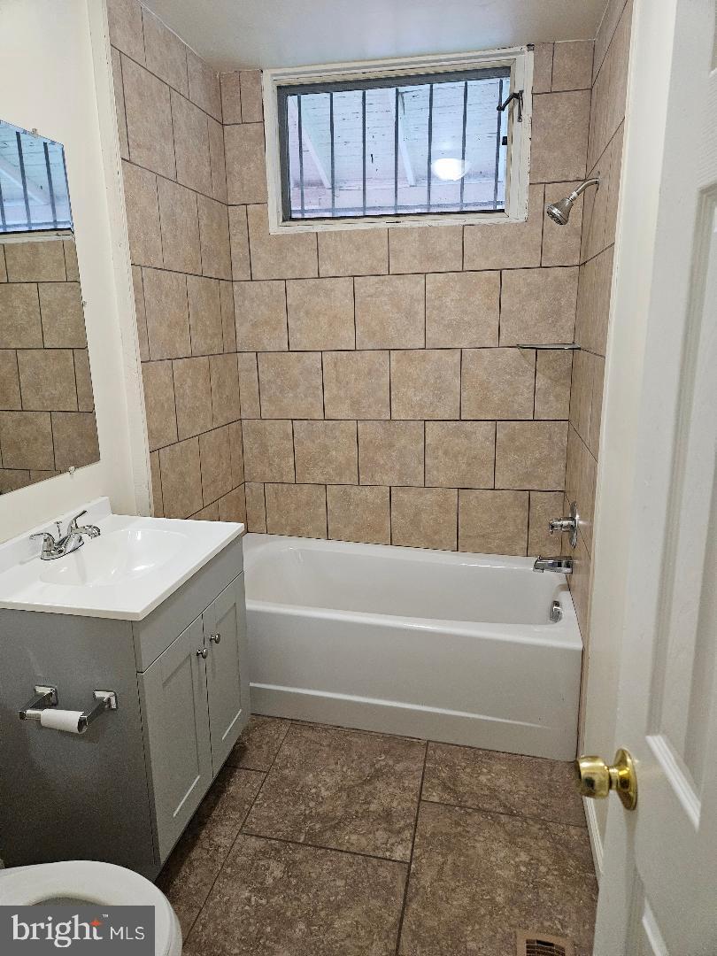 1635 U Street Southeast Washington, DC 20020 - Photo 11 of 33 Modern bathroom with tiled elegance.