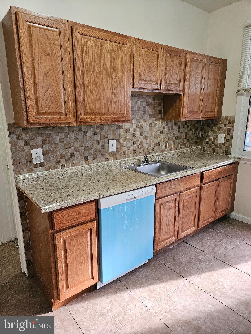 1635 U Street Southeast Washington, DC 20020 - Photo 23 of 33 Charming kitchen with warm wood cabinetry.