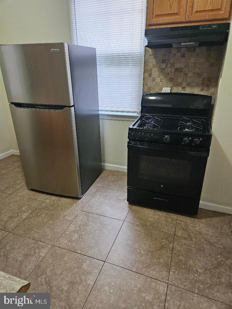 1635 U Street Southeast Washington, DC 20020 - Photo 26 of 33 Modern kitchen with sleek appliances.