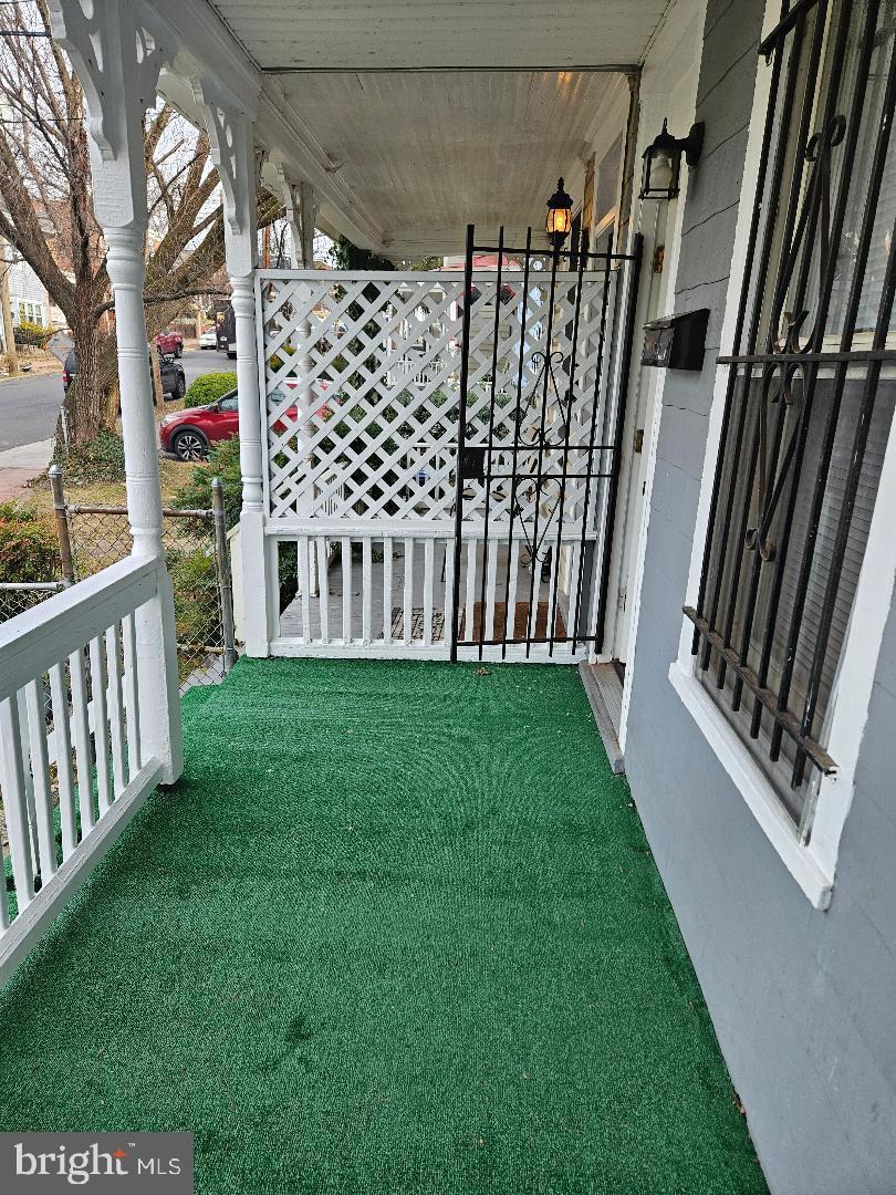1635 U Street Southeast Washington, DC 20020 - Photo 29 of 33 Charming porch with green turf and lattice gate.