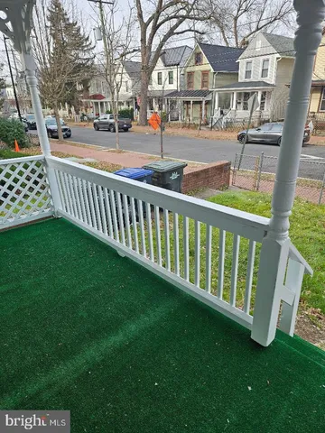 a view of a house with a wooden deck