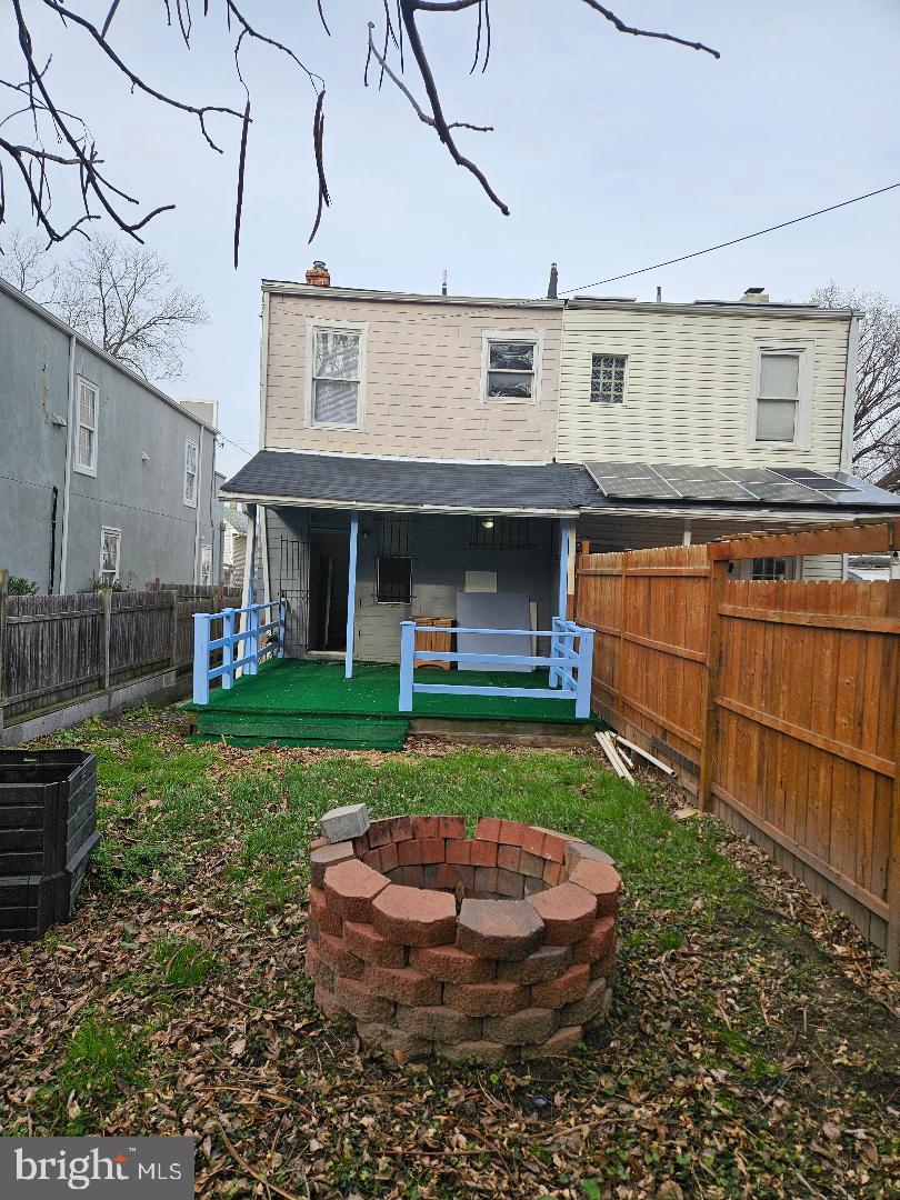 1635 U Street Southeast Washington, DC 20020 - Photo 31 of 33 Charming backyard with fire pit and greenery.