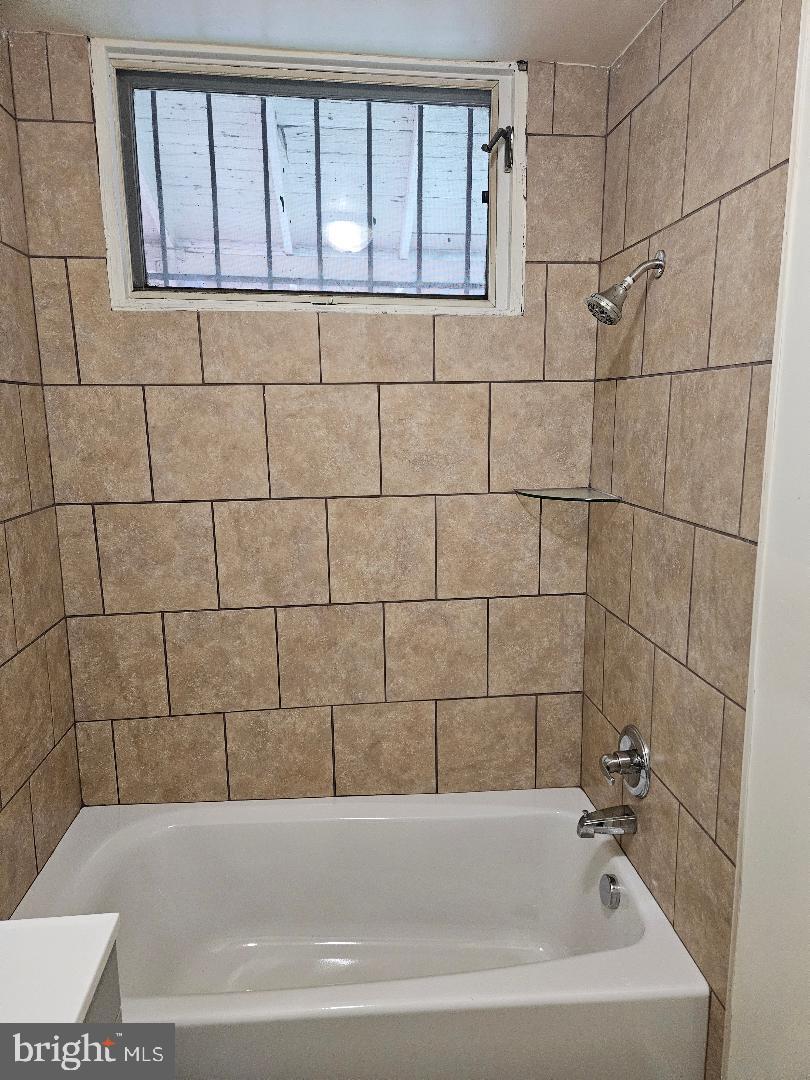 1635 U Street Southeast Washington, DC 20020 - Photo 10 of 33 Modern bath with tiled walls and natural light.