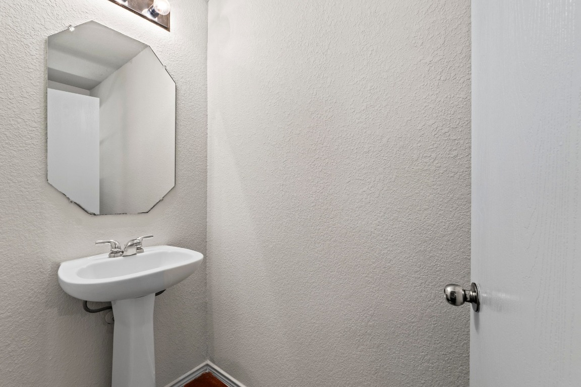 4608 Acers Lane Austin, TX 78725 - Photo 13 of 26 A convenient 1st floor half bath/powder room, great for guests.