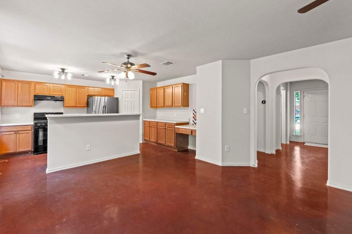 4608 Acers Lane Austin, TX 78725 - Photo 4 of 26 This angle showcases the open/functional layout and the stained concrete flooring throughout the main level.