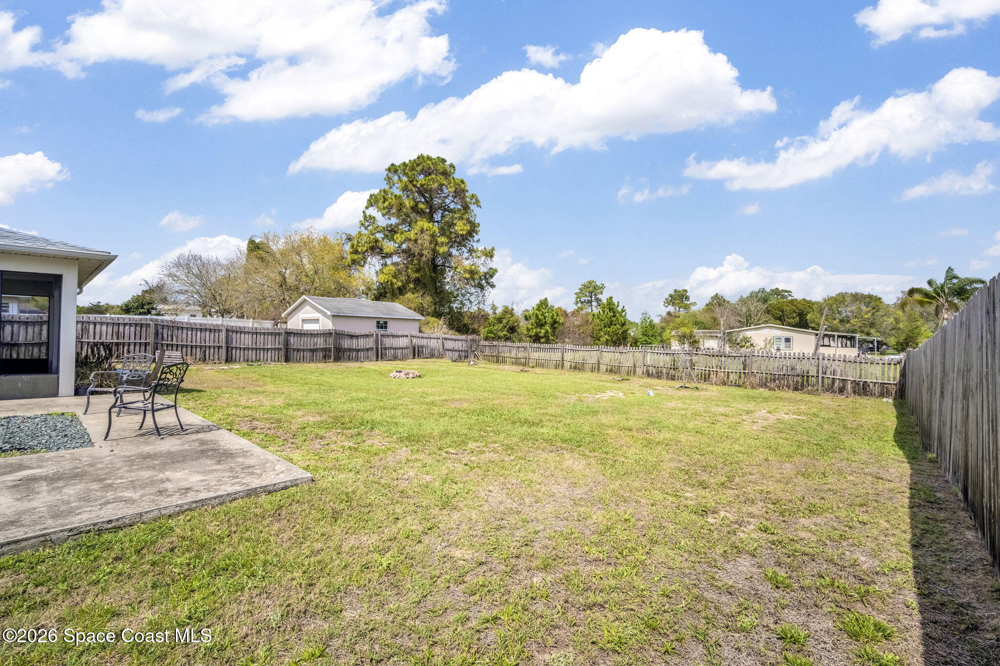 3404 Kilbee Street Mims, FL 32754 - Photo 26 of 30 a view of a lake with a big yard