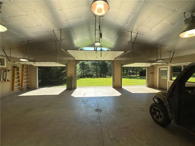 a view of a livingroom with a fireplace and window